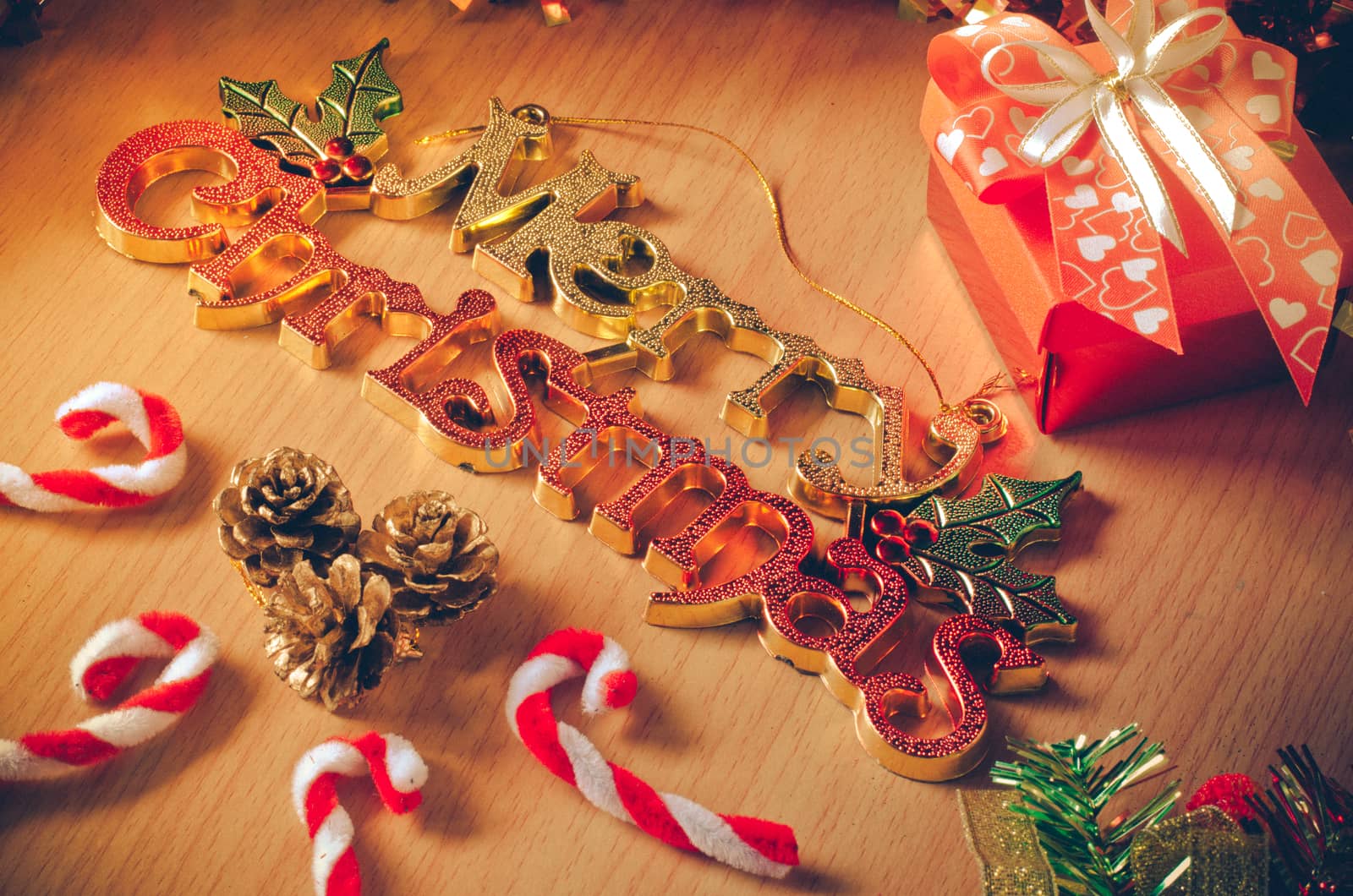 Merry Christmas greeting message on wooden background