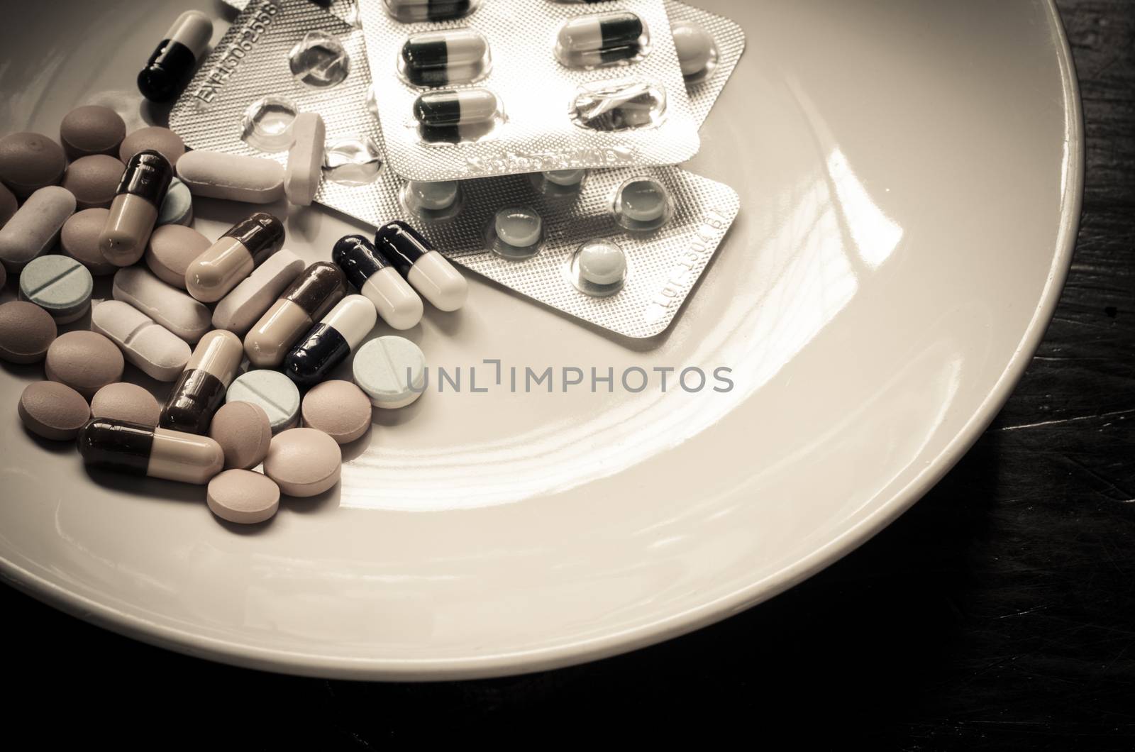 Many medications are dishes for the sick who could be administered to food - sepia tone.
