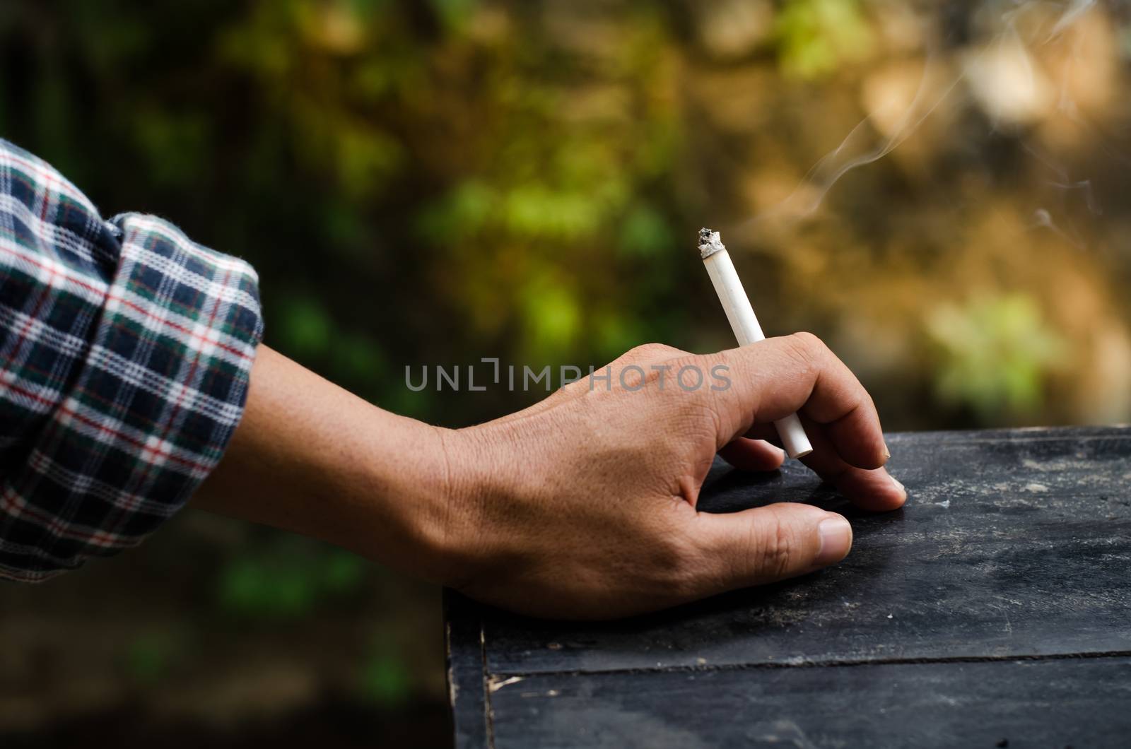 Smoking in the hands of men