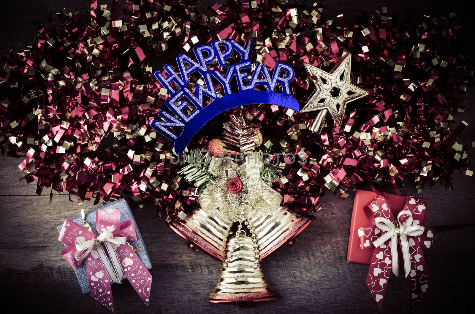 Merry Christmas greeting message on wooden background