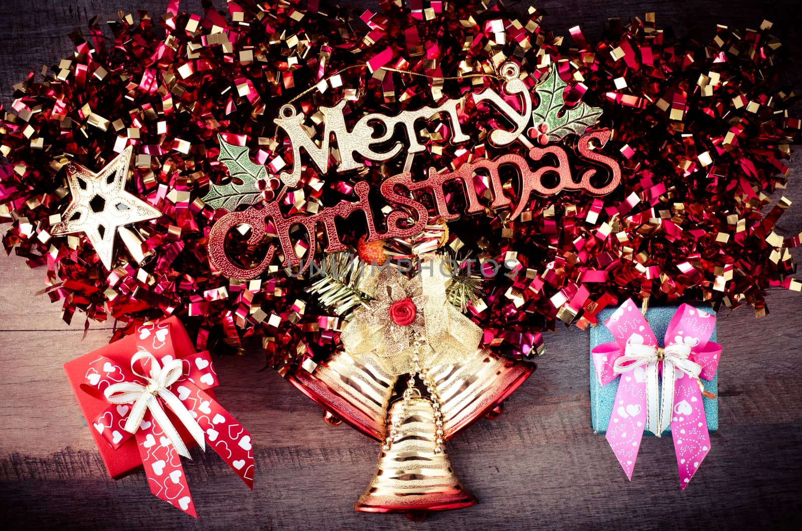 Merry Christmas greeting message on wooden background