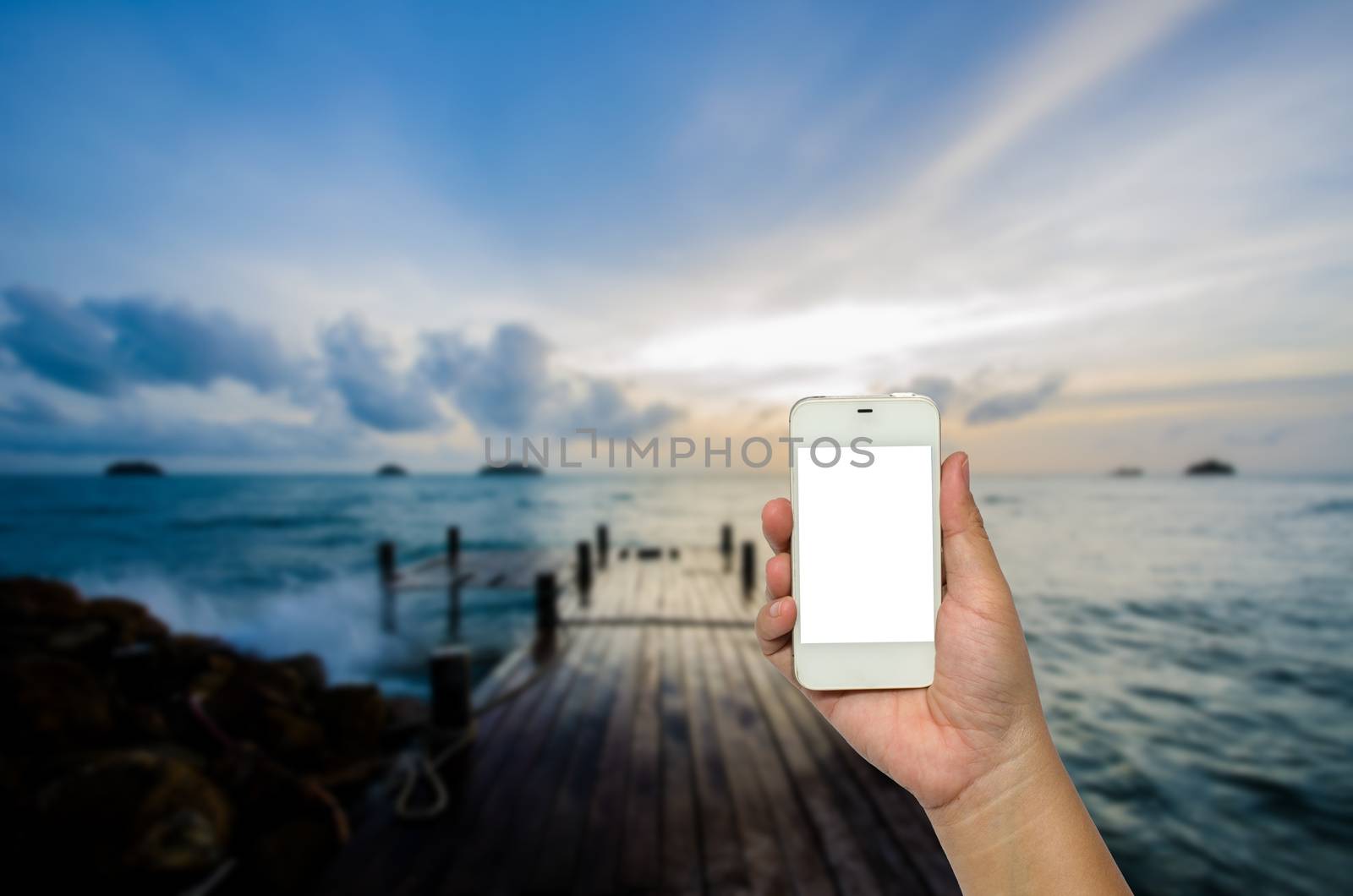 Mobile smart phone behind the harbor is beautiful.