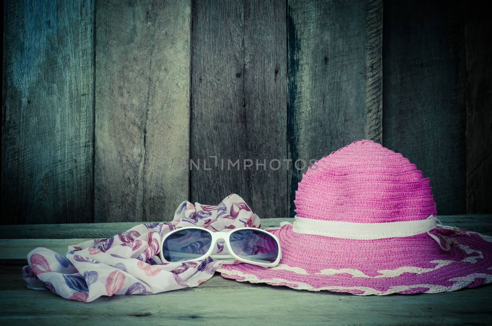 Travel accessories for young women Sombrero pink scarf sunglasses.on wood