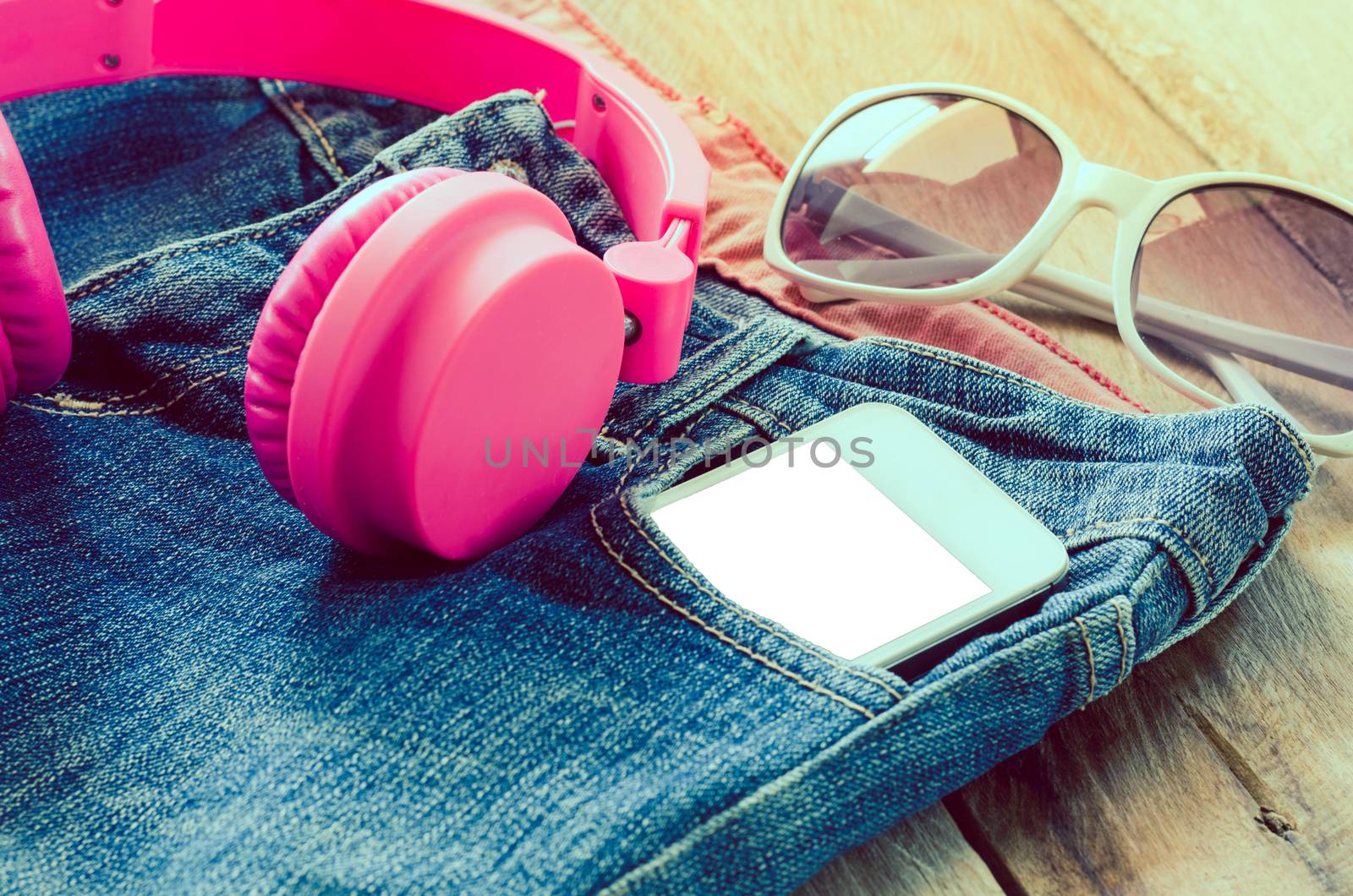 accessory jeans smart devices Earphone,glasses on a wooden floor