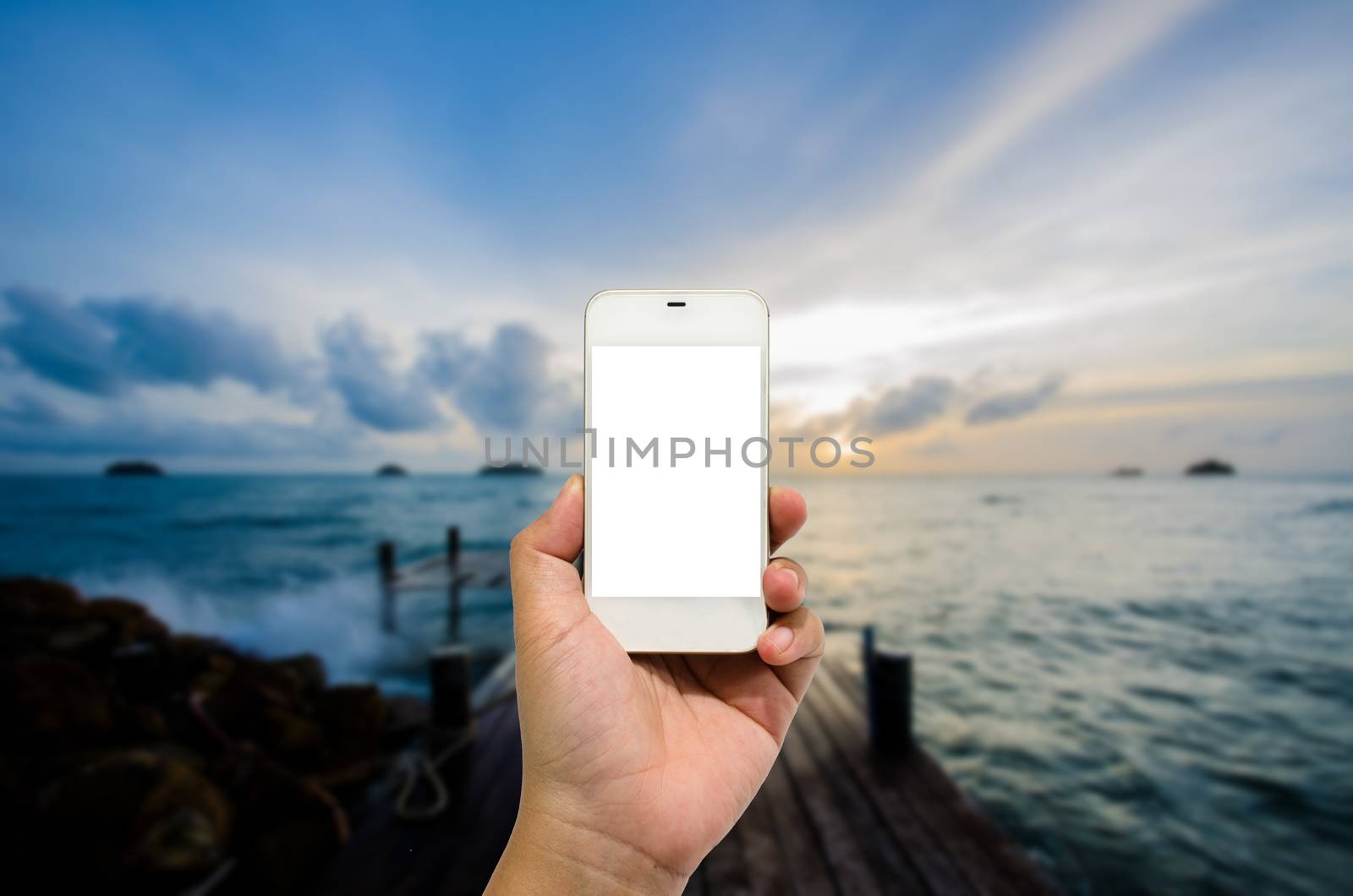 Mobile smart phone behind the harbor is beautiful.