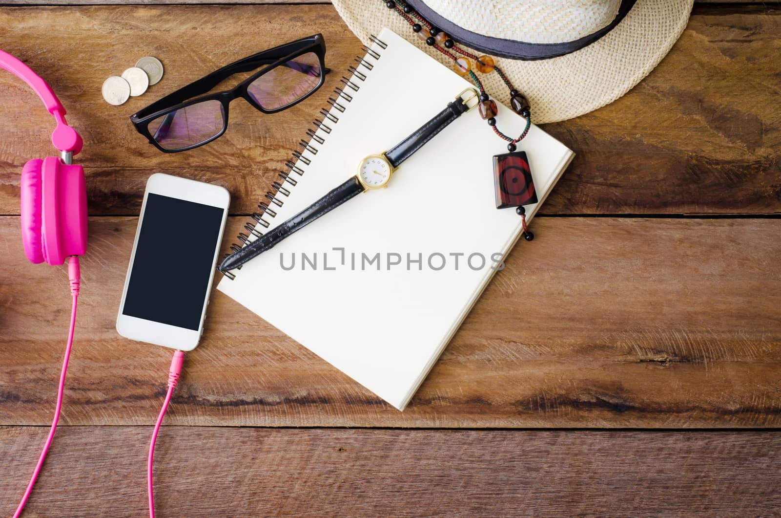 accessories, glasses,notebook, watch, smart phone, earphone, notebook, on the wood