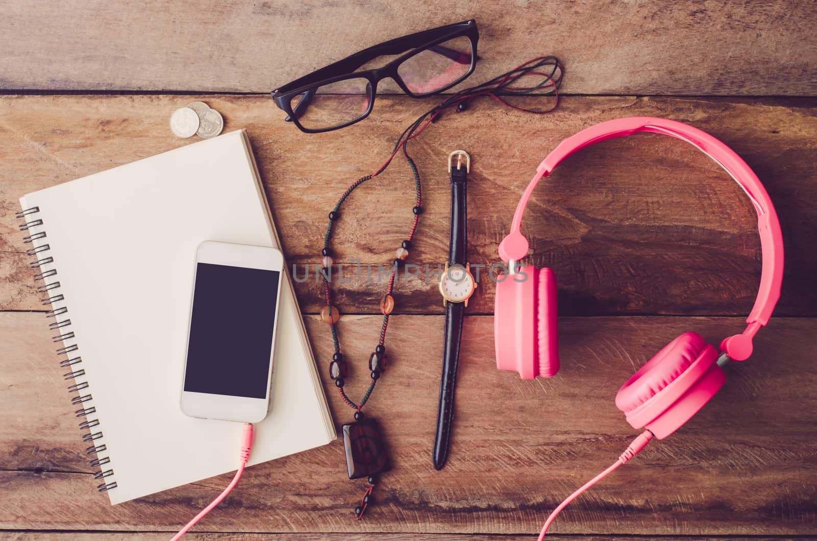 accessories, glasses,glove, notebook, watch, smart phone, on the wood