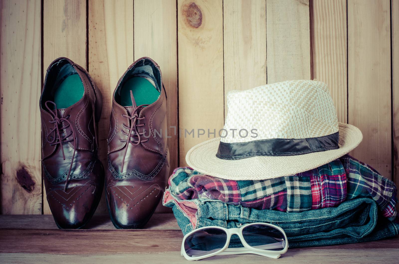Travel accessories. Shirts, jeans, hats,shoes, ready for the trip