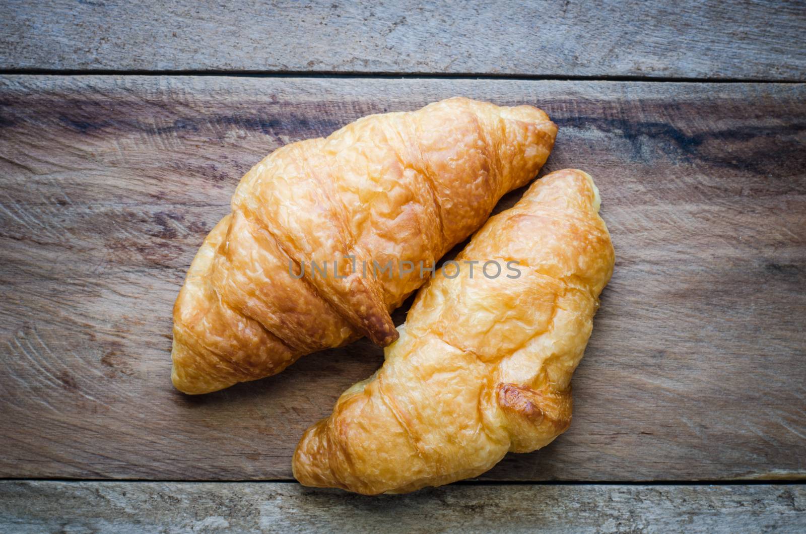 Croissants on a wooden floor