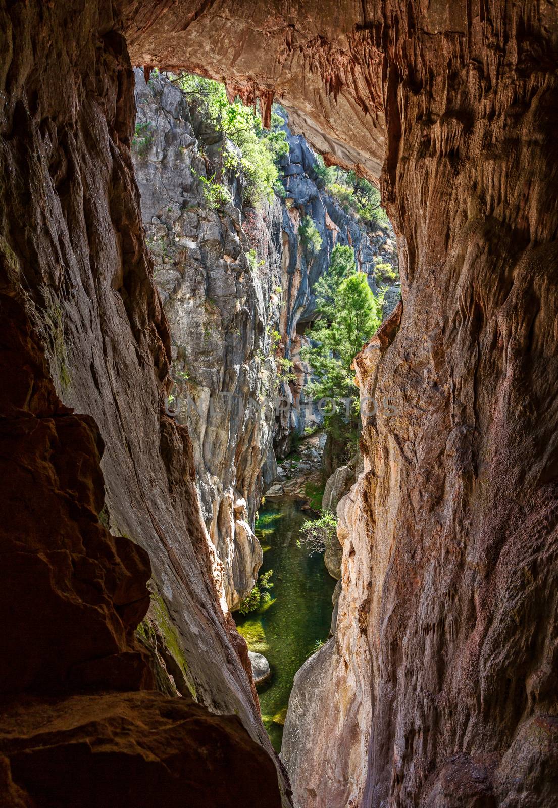 Views through the tinted cave to the narrow canyon by lovleah