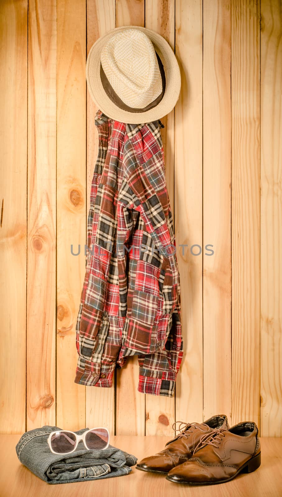 costume hanging on wooden wall background - still life tone vintage by photobyphotoboy