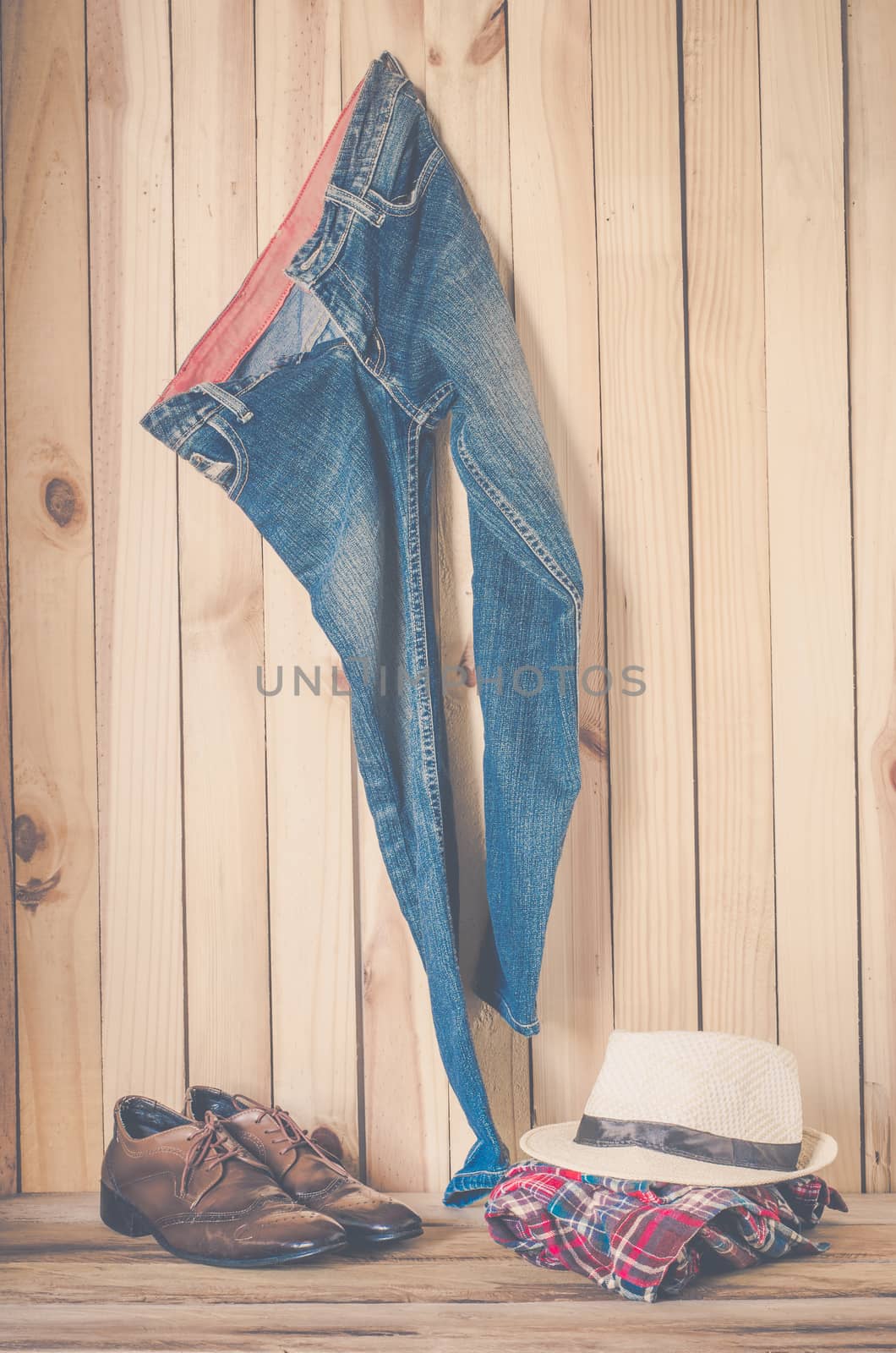 costume hanging on wooden wall background - still life tone vintage