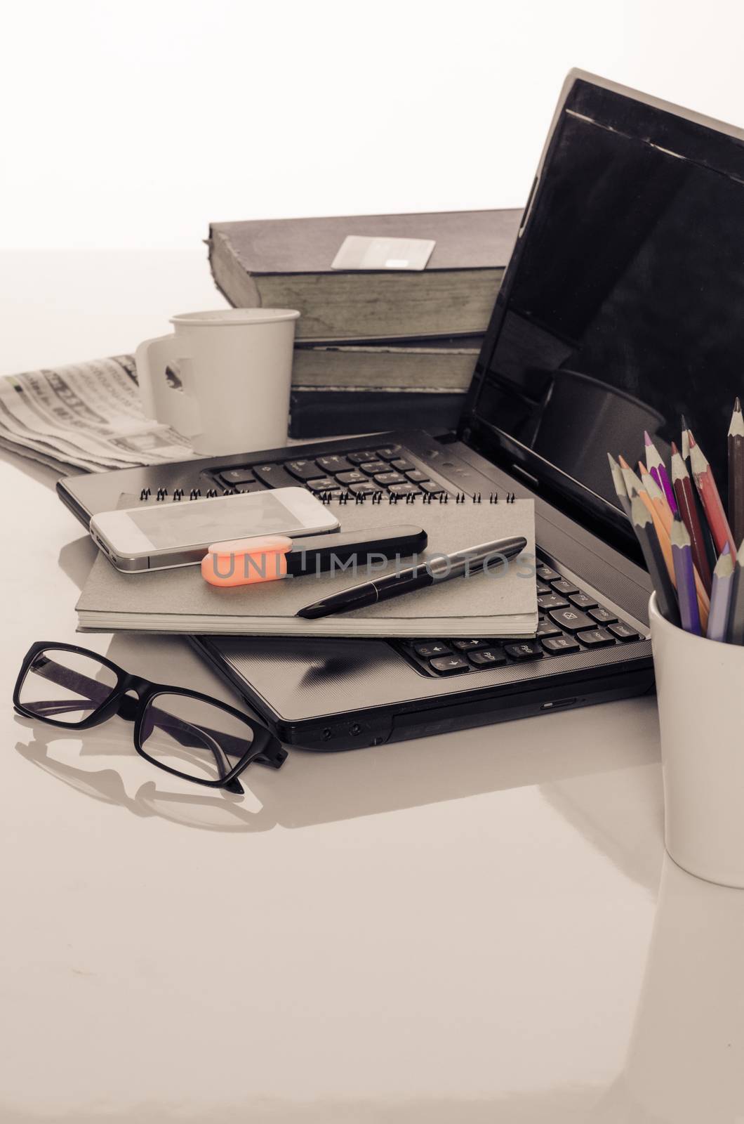 office desk with laptop with business accessories and cup of coffee by photobyphotoboy