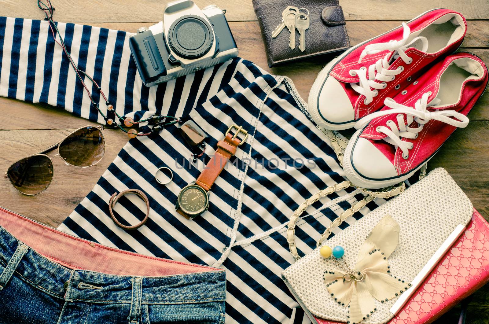 Travel accessories and costume on wooden floor by photobyphotoboy