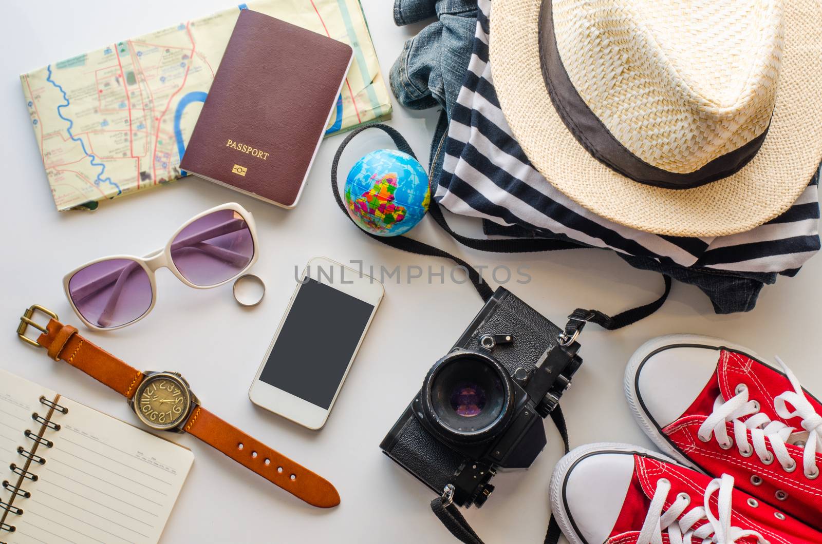 Travel accessories and costume on white background by photobyphotoboy