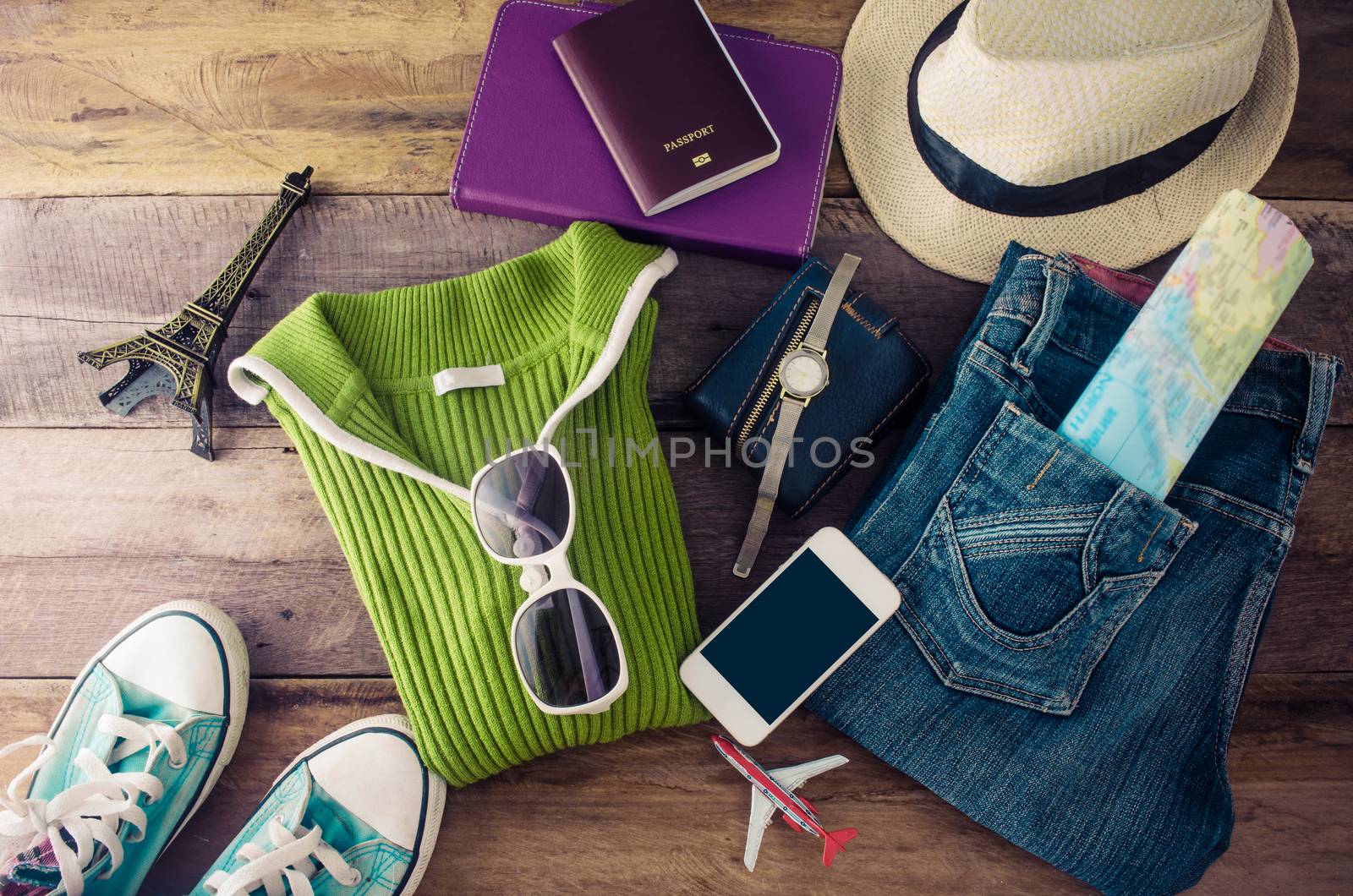 Travel accessories and costume on wooden floor for trip by photobyphotoboy