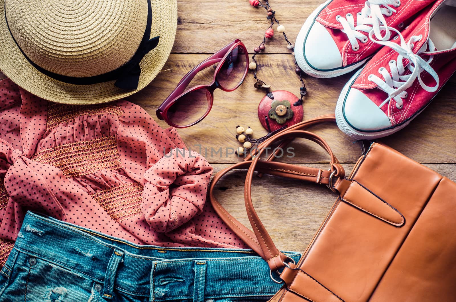 clothing for women, placed on a wooden floor. by photobyphotoboy