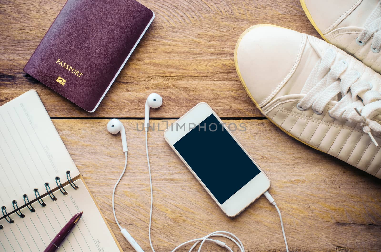 Tourism planning and equipment needed for the trip on wooden floor