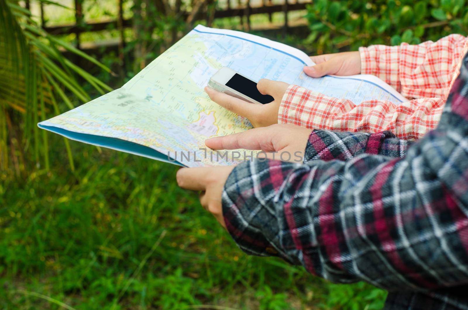 view of a young planning a journey looking at a map