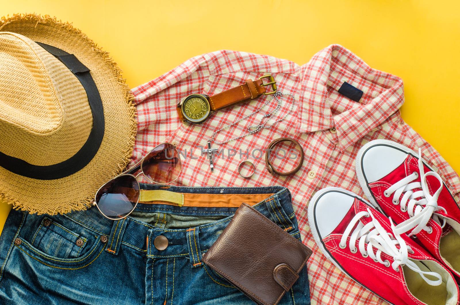Clothing and accessories for trip on yellow floor