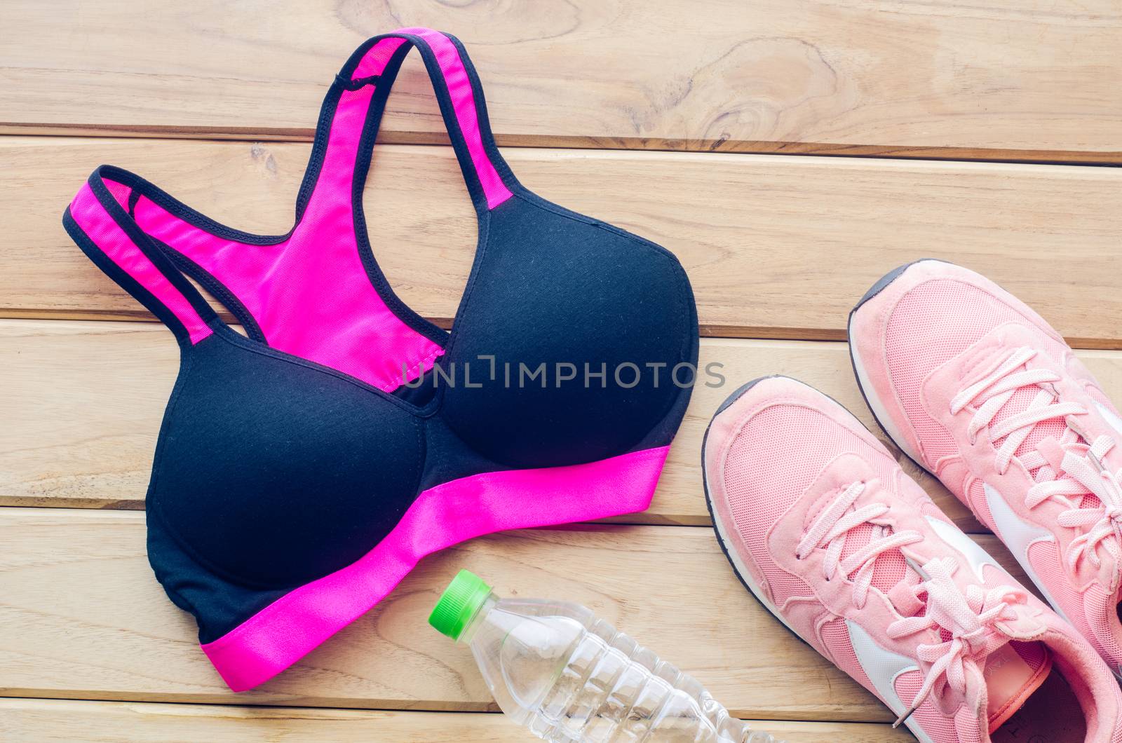 fitness concept with Exercise Equipment on wooden background.