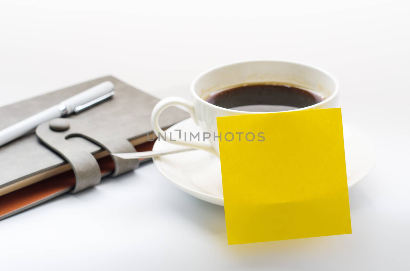 coffee cup, notebook on white background