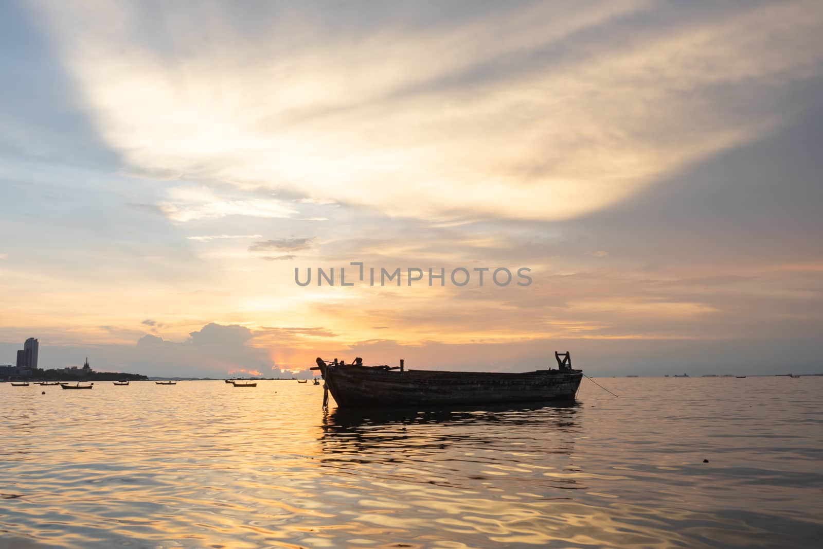 Boat in the ocean. Sunset scene.
