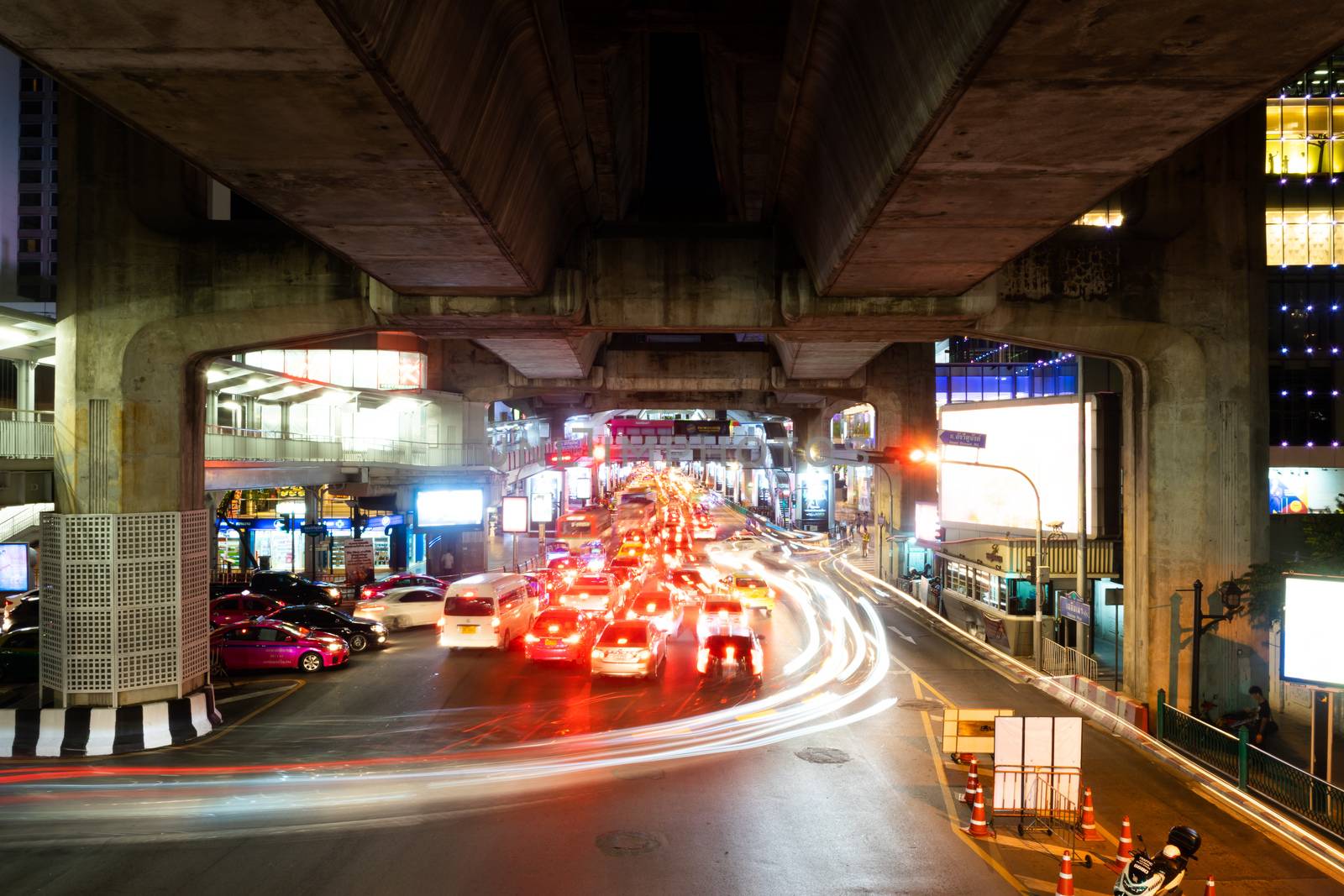 SEPTEMBER 25, 2018 : BANGKOK, THAILAND - Long Exposure from cars light at Ratchaprasong, Siam intersection night scene
