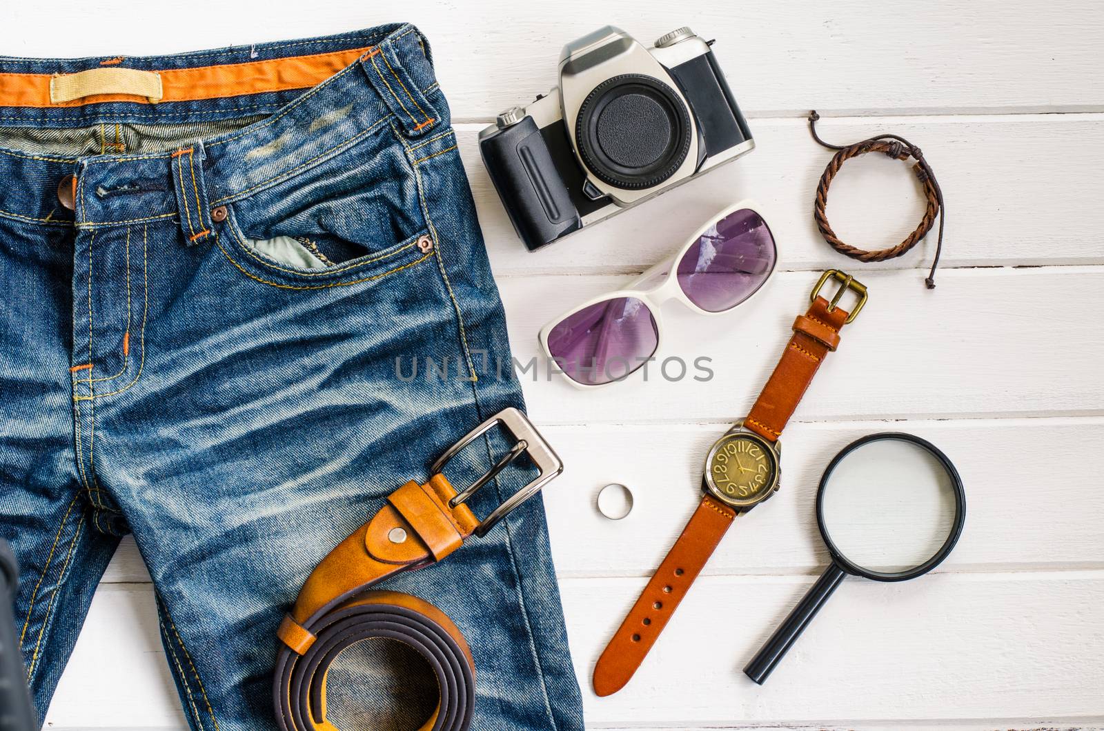 Travel accessories and costume on white background
