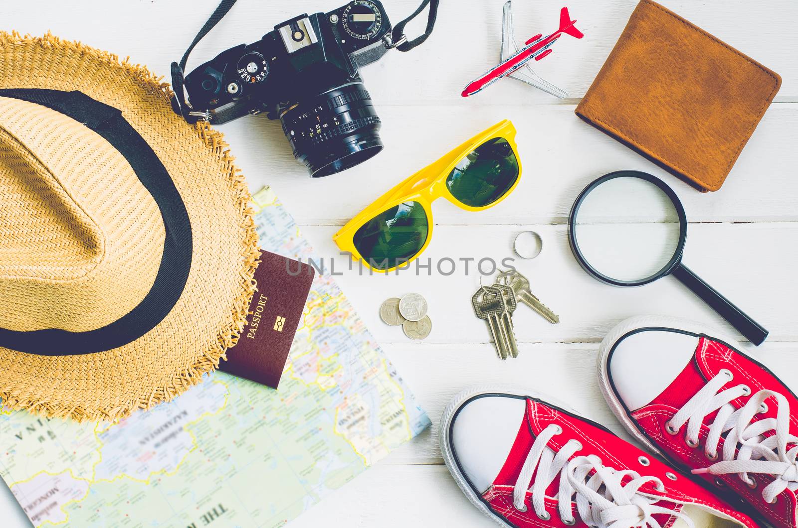 Travel accessories and costume on white background