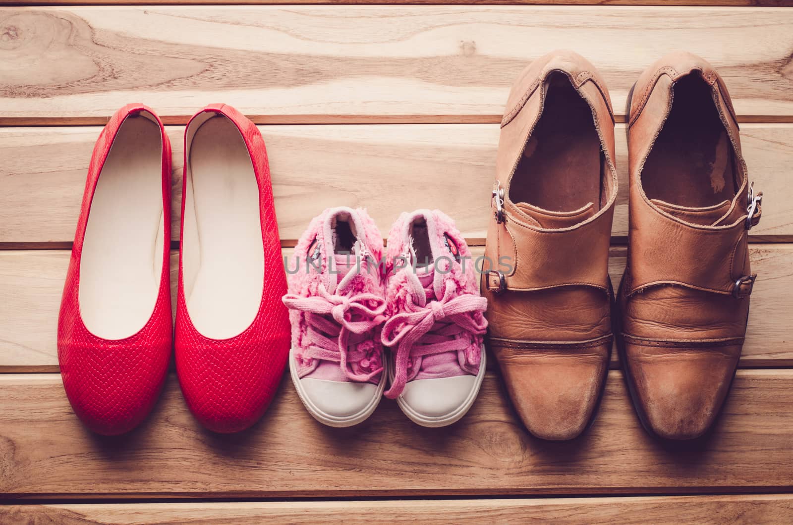 shoes, three pairs of dad, mom, daughter - the family concept