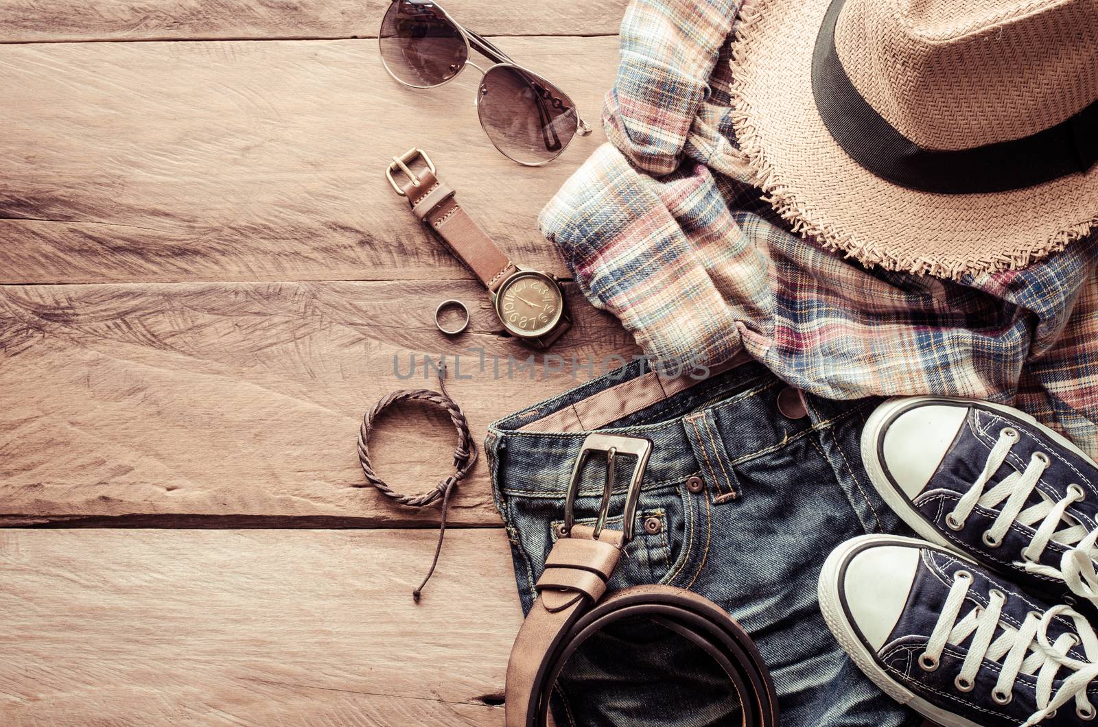 Travel accessories and costume on wooden floor by photobyphotoboy