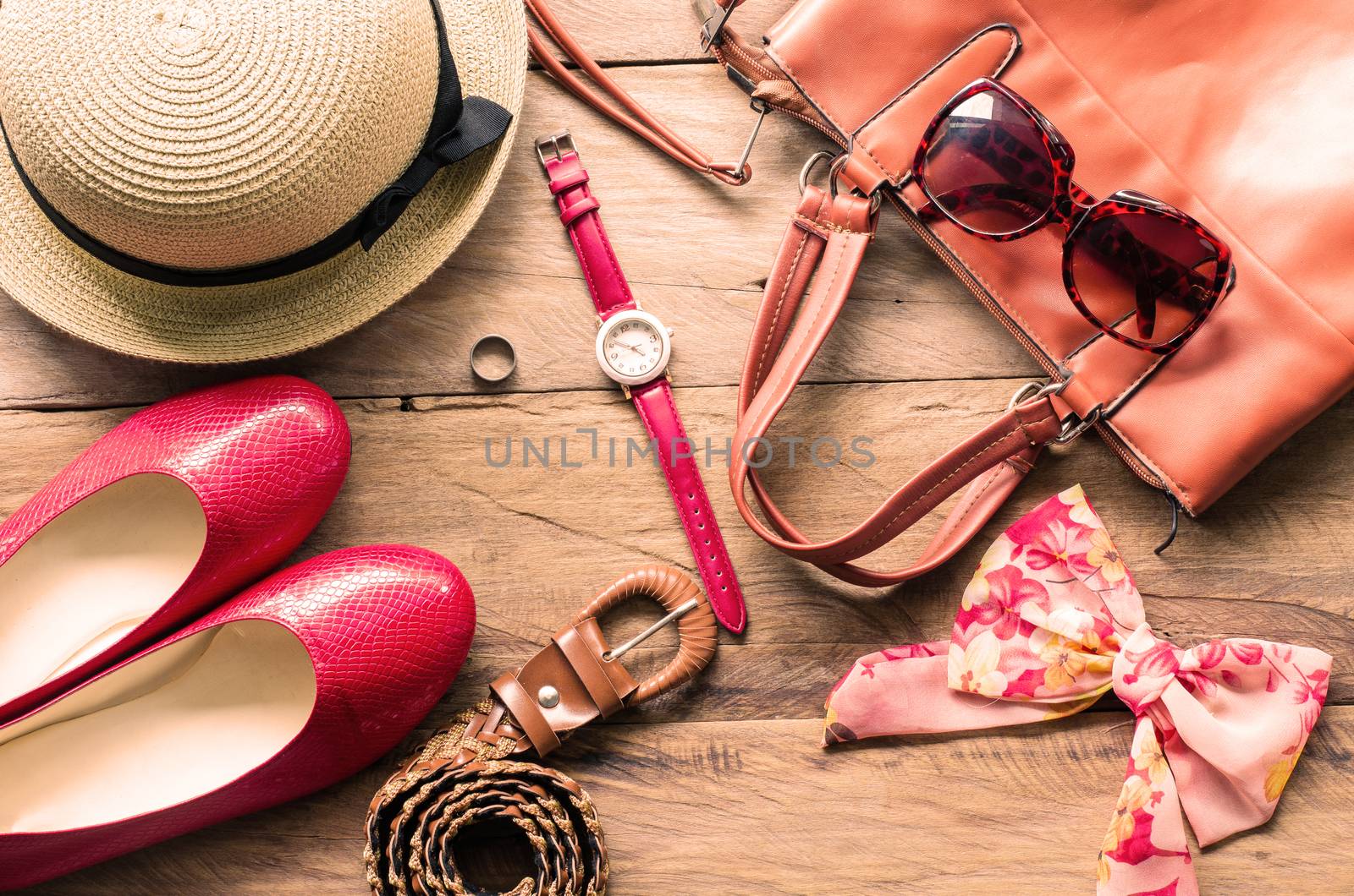 Travel accessories on wooden floor ready for travel by photobyphotoboy