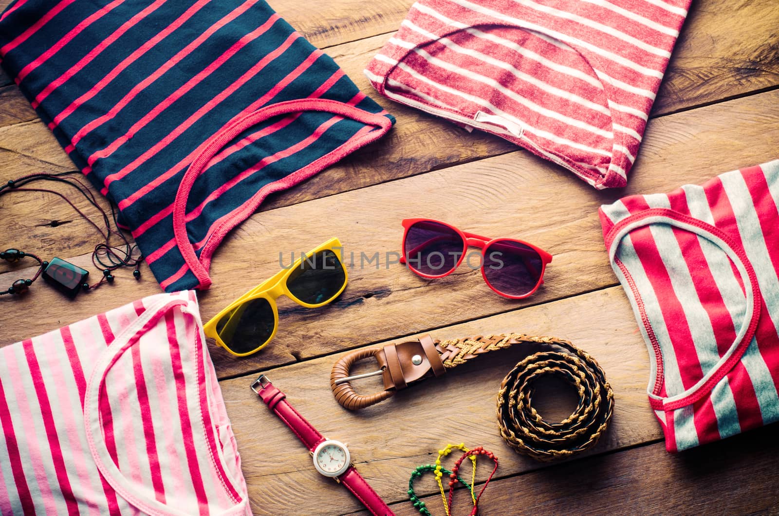 clothing for women, placed on a wooden floor.