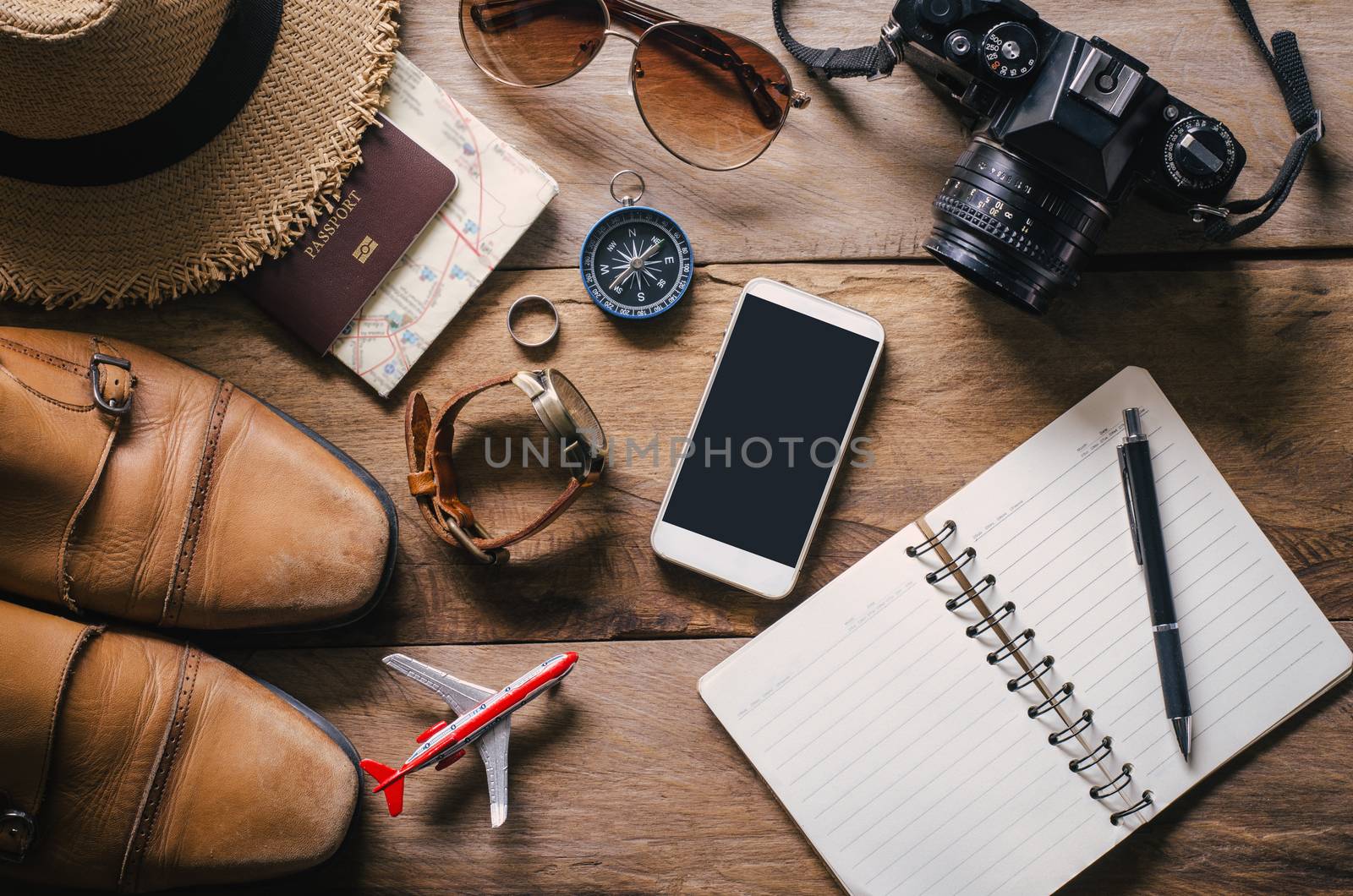 Travel accessories on wooden floor ready for travel