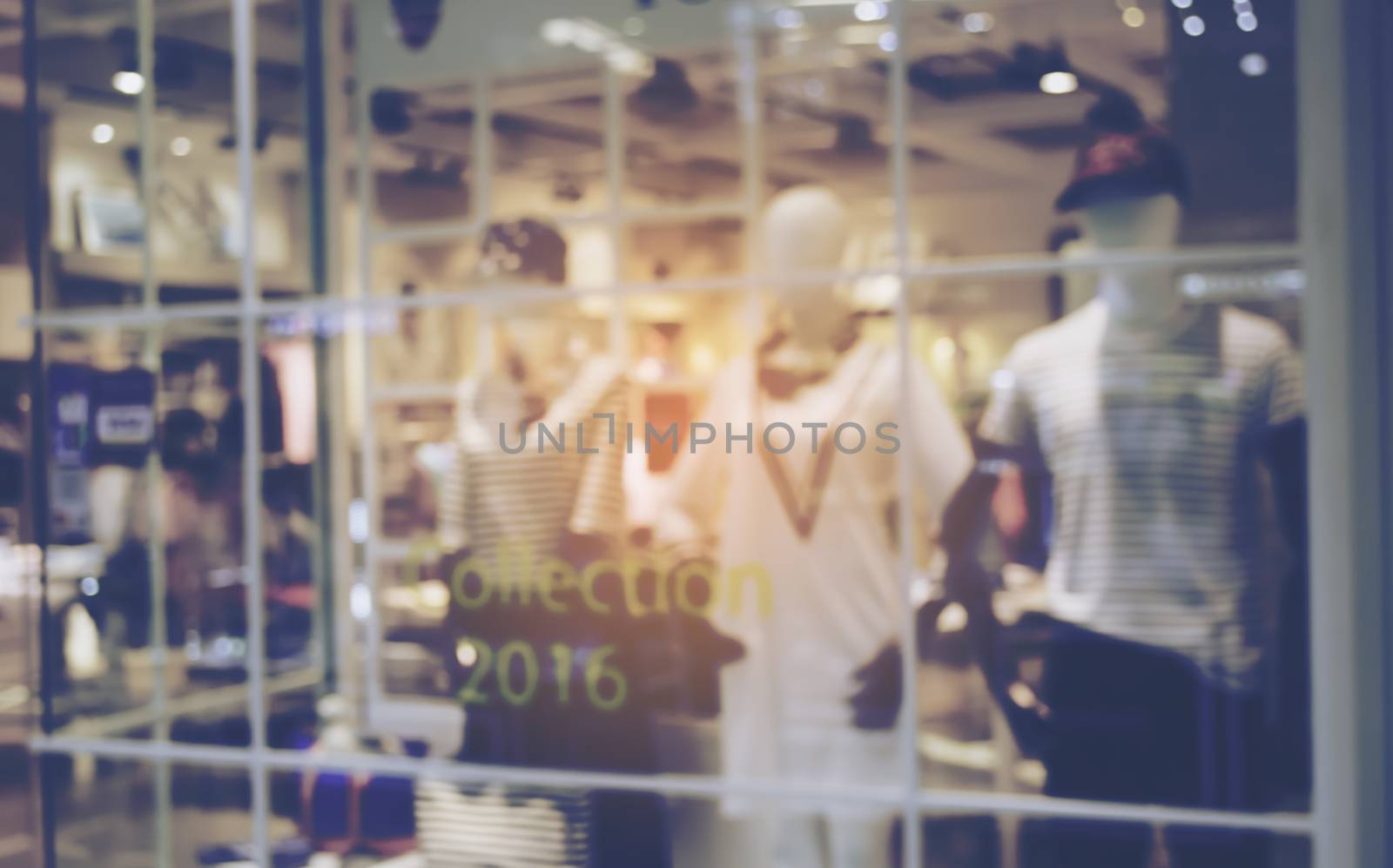 blurred image of shopping mall and people for background by photobyphotoboy