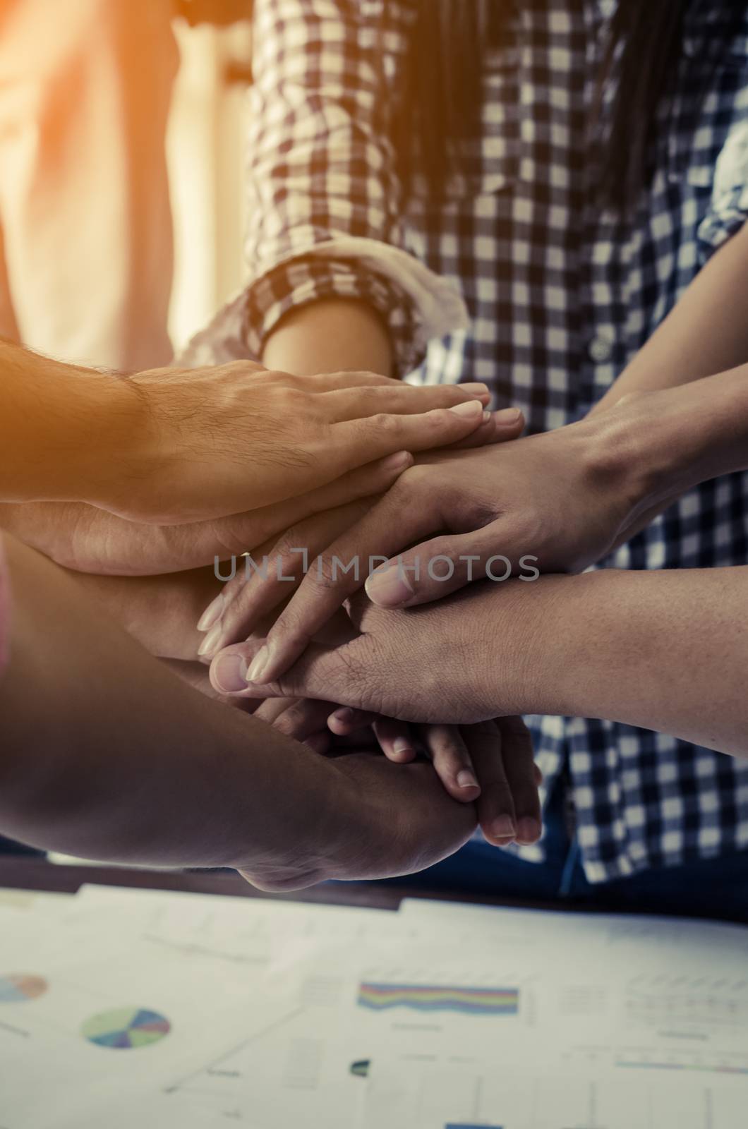 Concept of teamwork: Close-Up of hands business team showing unity with putting their hands together. by photobyphotoboy