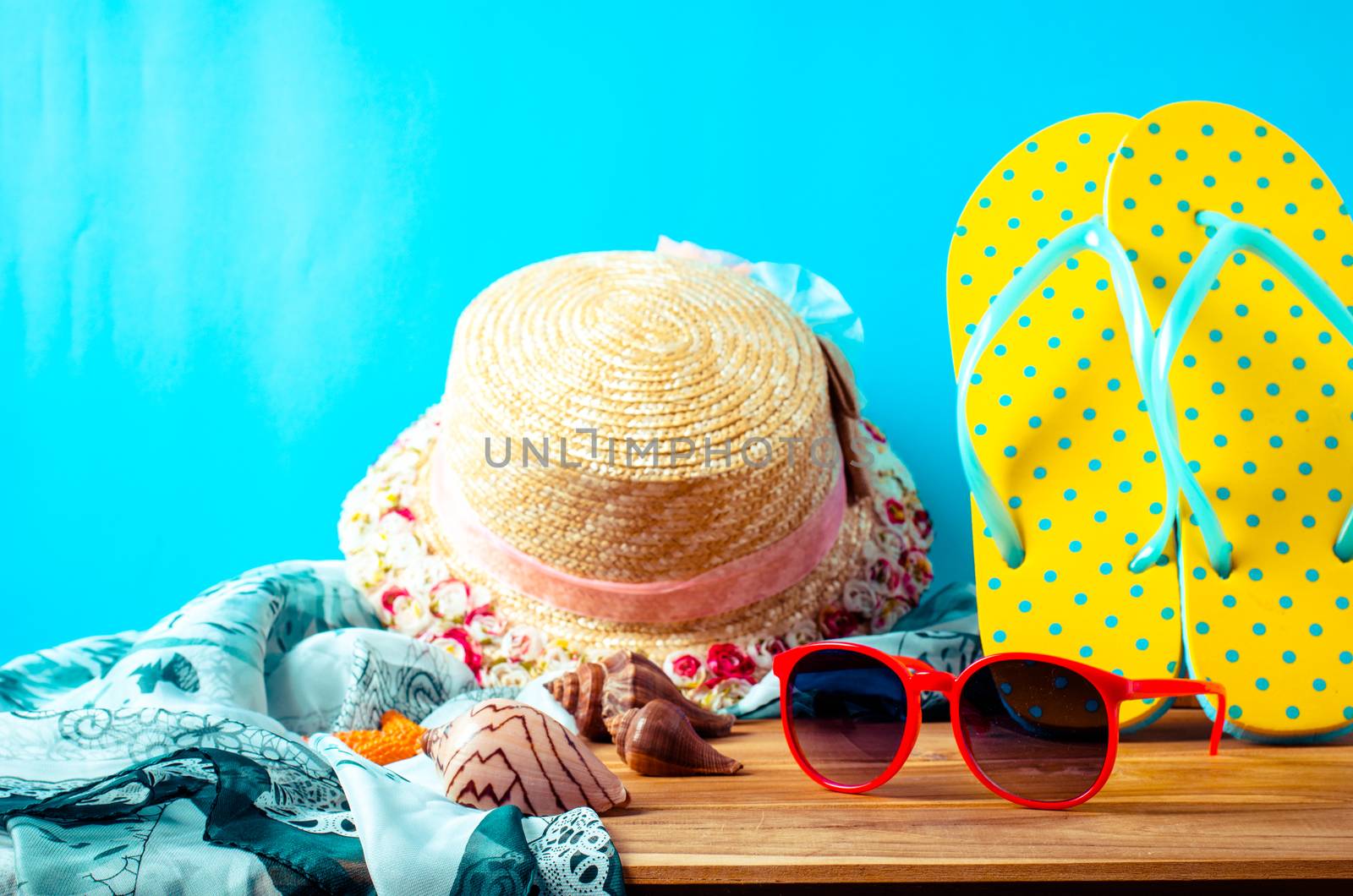 accessories for summer on wooden blue background