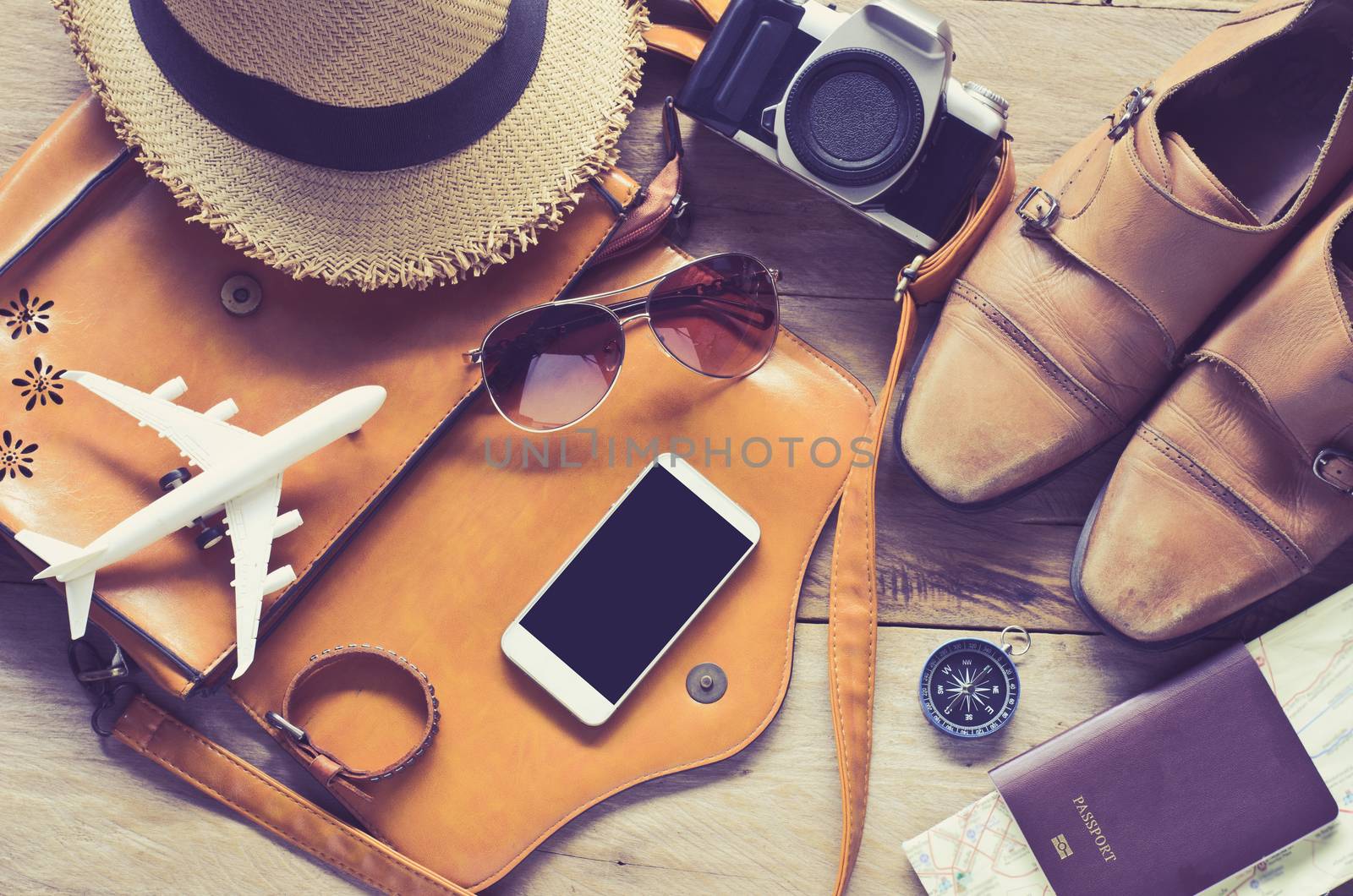 Travel accessories on wooden floor ready for travel