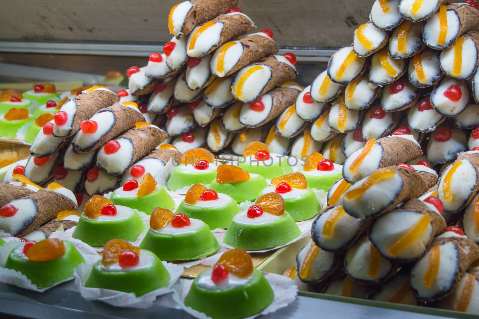 close-up of counter with beautiful and delicious cakes in Cagliari, Sardinia by claire_lucia