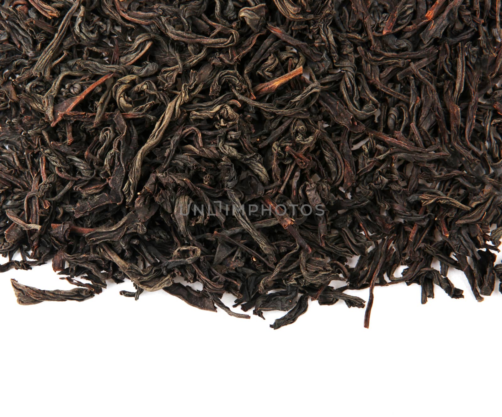 Black Tea Leaves Isolated On White Background by nenovbrothers