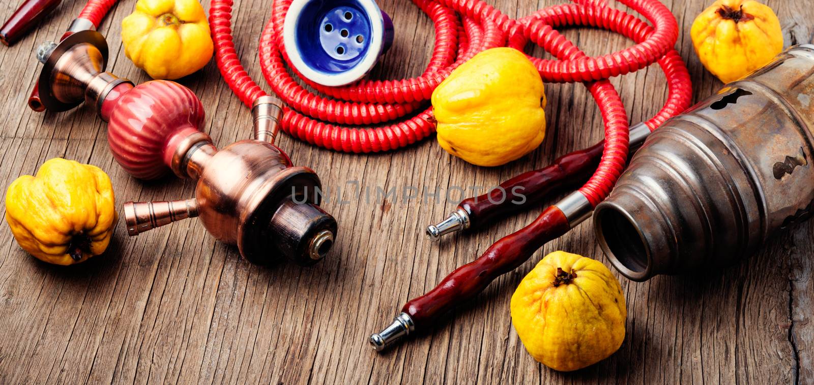 Oriental smoking hookah with mouthpieces with quince flavor.Shisha advertising
