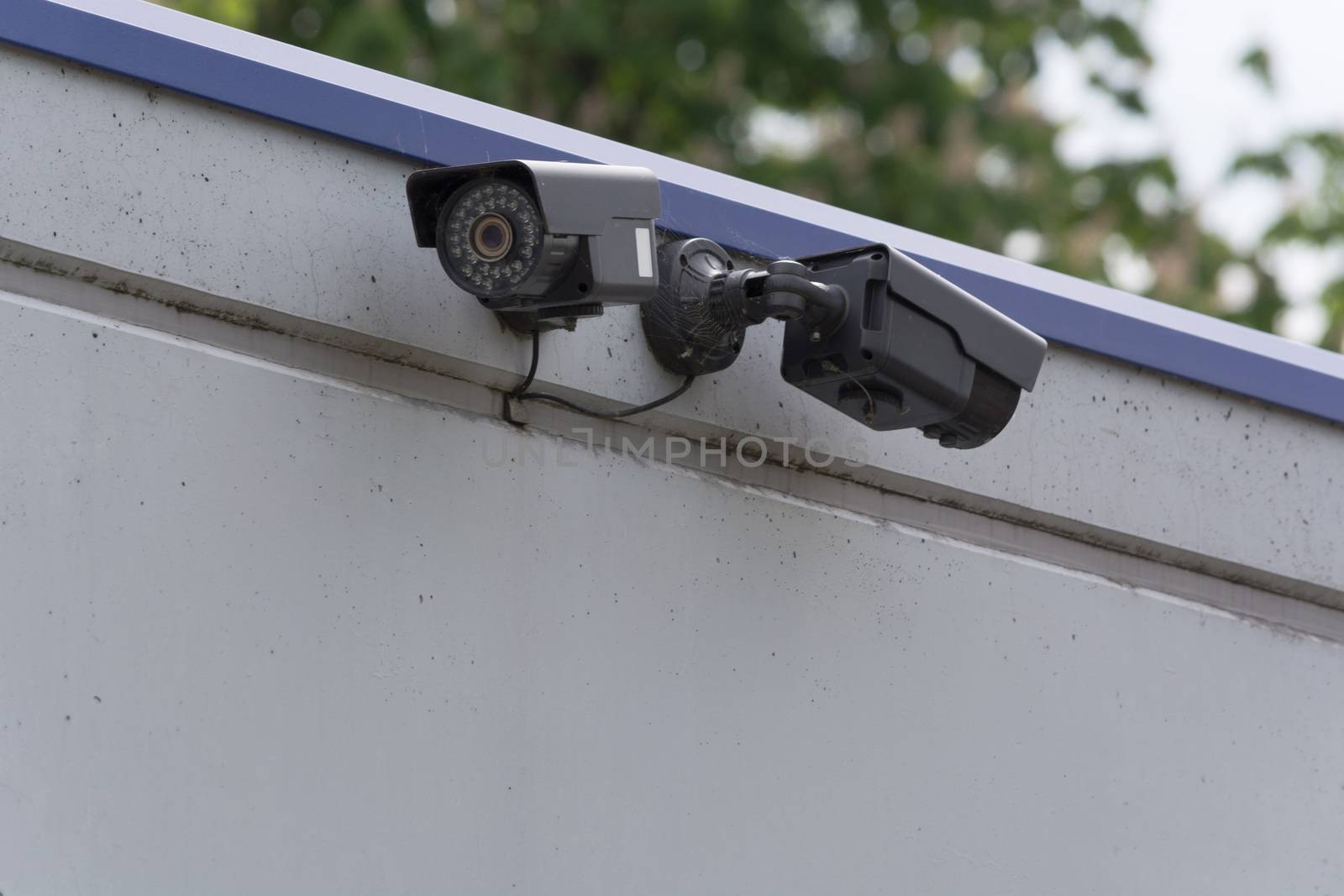 Two CCTV surveillance cameras. Concept security in the office building.