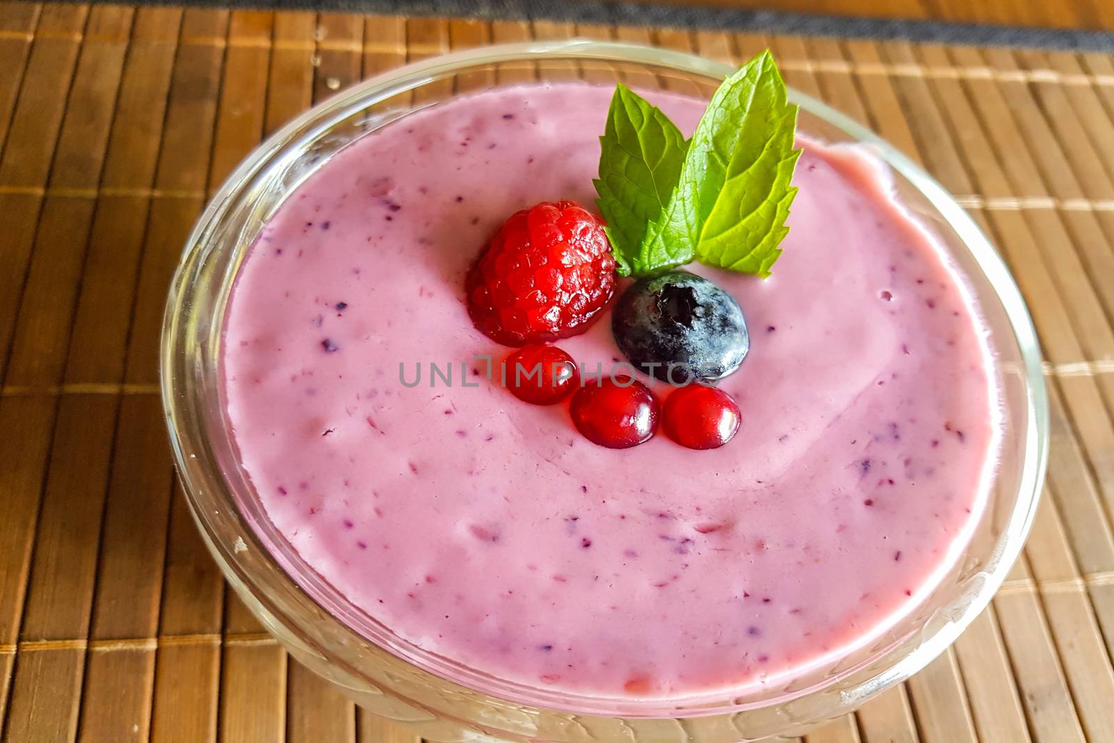 Low calorie food. Fresh healthy blueberries raspberries and redcurrants smoothie