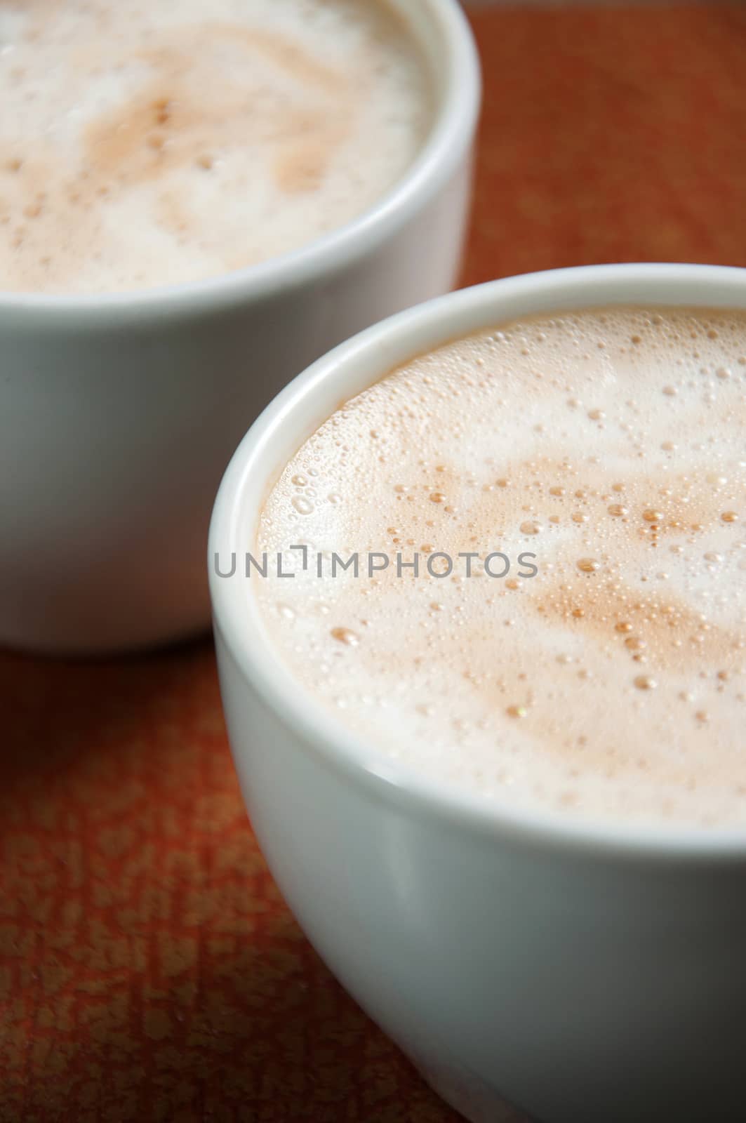 Cup with frothed cappuccino. Coffee drink in cups.