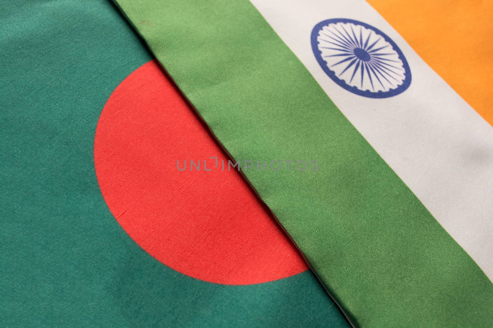 Bangladesh and Indian flags placed on table.