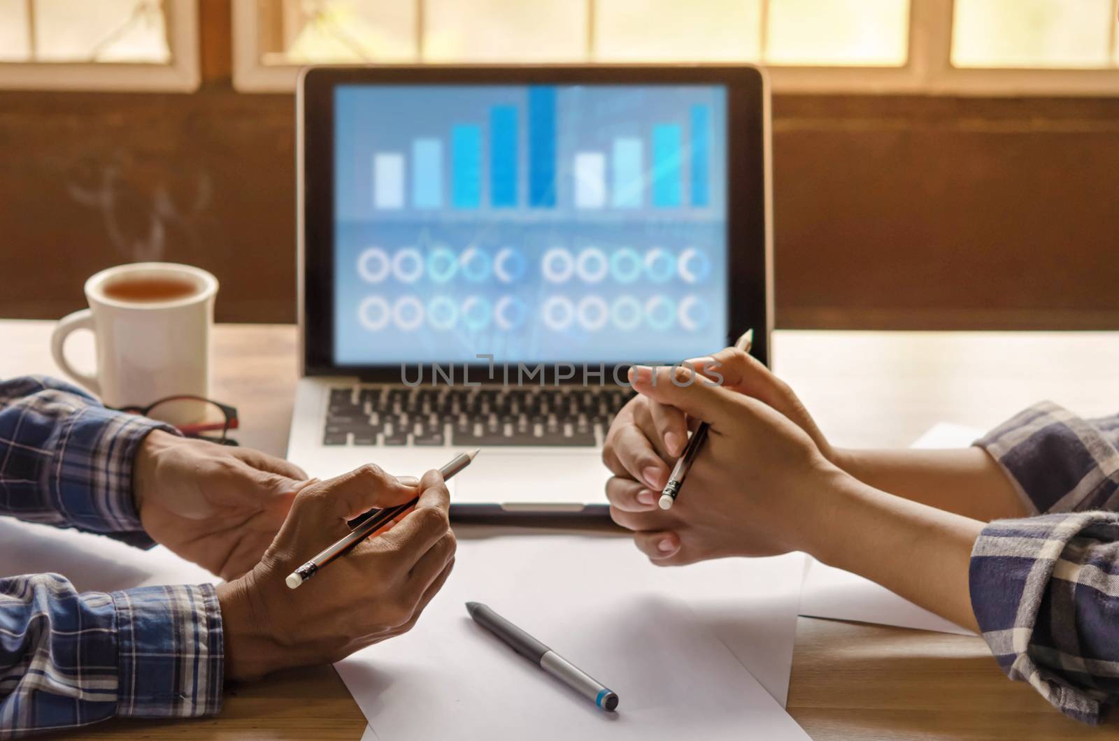 Close-up of  business people working on project together. Teamwork , hipster tone