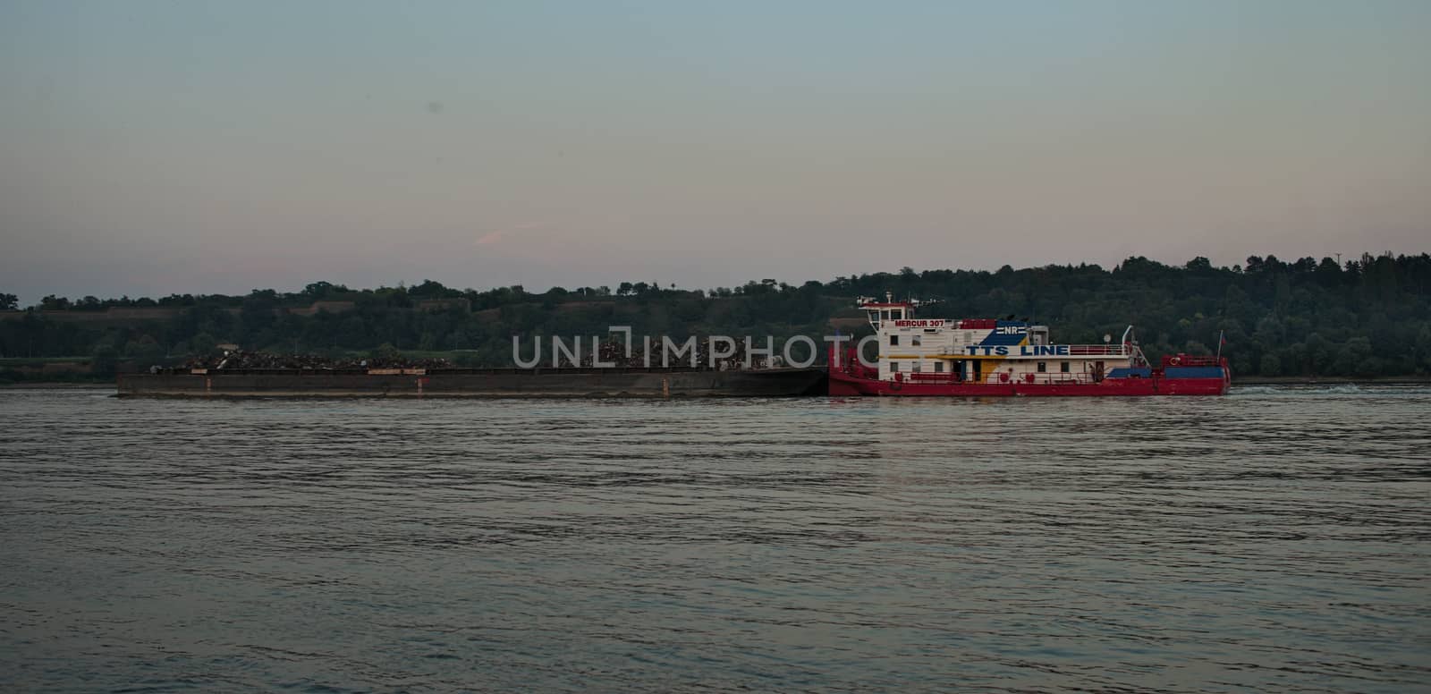 NOVI SAD, SERBIA - August 12th: Cargo ship slowly flowing on Danube