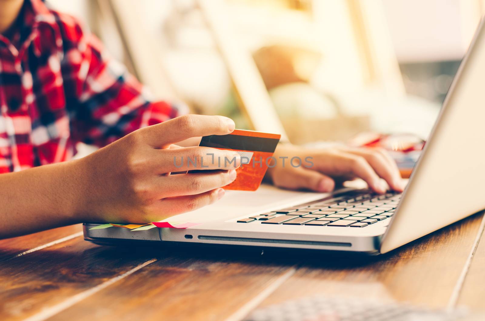 Woman holding credit cards and mobile phones are now shopping ov by photobyphotoboy