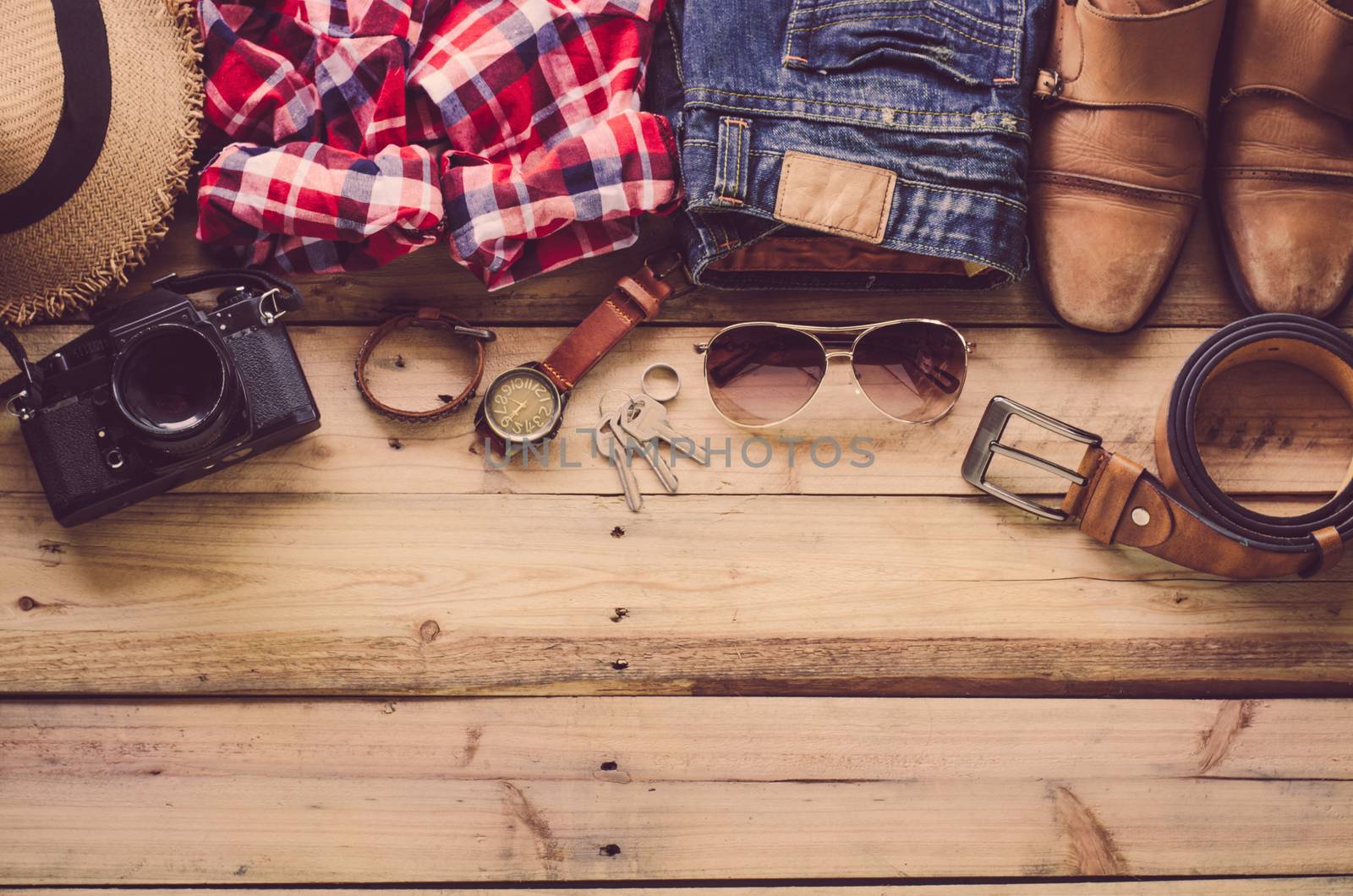 Travel Clothing accessories Apparel along on wooden floor 